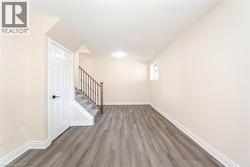 Basement featuring wood finished floors and stairway - 