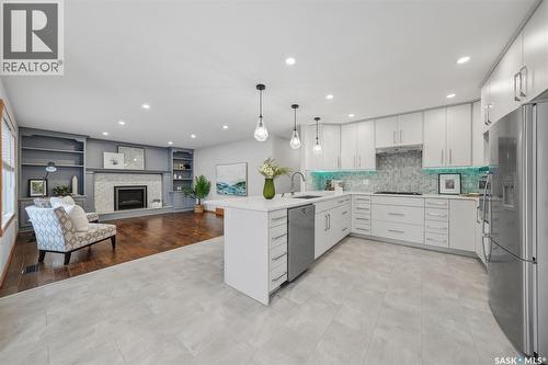 214 Braeburn Place, Saskatoon, SK - Indoor Photo Showing Kitchen With Fireplace With Upgraded Kitchen