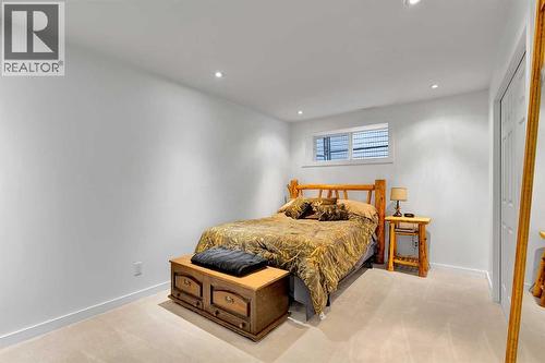 65 Sunset Heights, Cochrane, AB - Indoor Photo Showing Bedroom