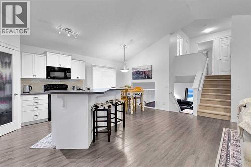 65 Sunset Heights, Cochrane, AB - Indoor Photo Showing Kitchen