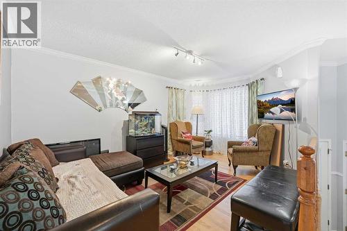 311 Saddlecreek Point Ne, Calgary, AB - Indoor Photo Showing Living Room
