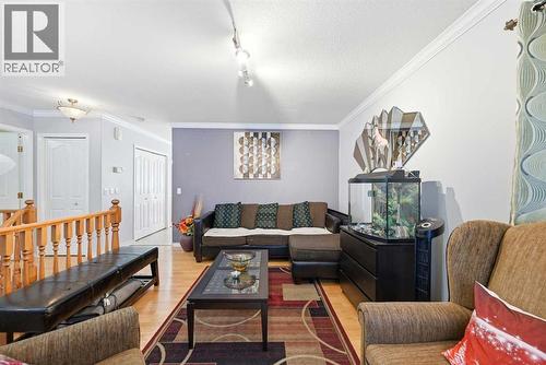 311 Saddlecreek Point Ne, Calgary, AB - Indoor Photo Showing Living Room