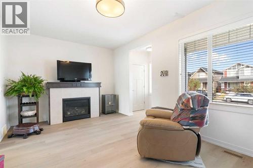 167 Fireside Drive, Cochrane, AB - Indoor Photo Showing Living Room With Fireplace