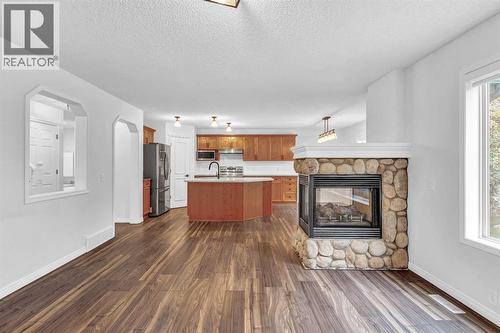 331 Springbank Place Sw, Calgary, AB - Indoor Photo Showing Living Room With Fireplace
