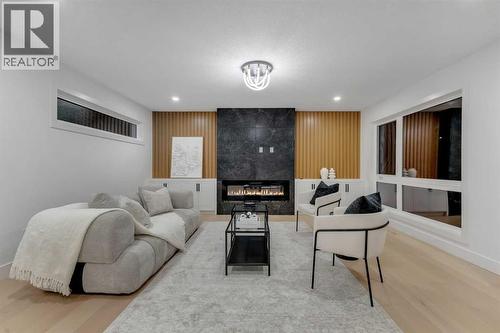 9419 Academy Drive Se, Calgary, AB - Indoor Photo Showing Living Room With Fireplace