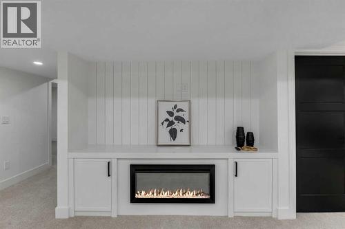 9419 Academy Drive Se, Calgary, AB - Indoor Photo Showing Other Room With Fireplace