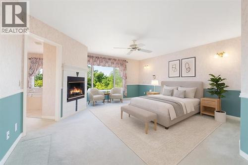 1600 Evergreen Hill Sw, Calgary, AB - Indoor Photo Showing Bedroom With Fireplace