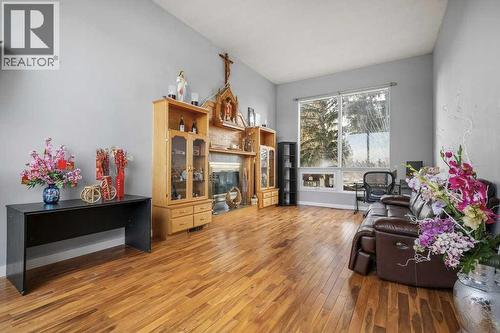 4704 Marbury Place Ne, Calgary, AB - Indoor Photo Showing Living Room With Fireplace