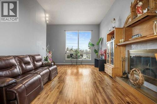4704 Marbury Place Ne, Calgary, AB - Indoor Photo Showing Living Room With Fireplace