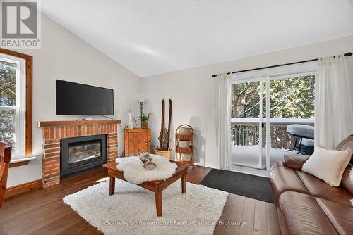 345 - 11 Harbour Street W, Collingwood, ON - Indoor Photo Showing Living Room With Fireplace