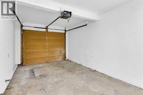 1418 Ranchlands Road Nw, Calgary, AB - Indoor Photo Showing Garage