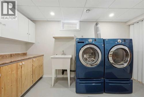 63 Huntmeadow Road Ne, Calgary, AB - Indoor Photo Showing Laundry Room