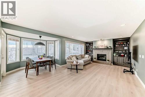 668 Scimitar Bay Nw, Calgary, AB - Indoor Photo Showing Living Room With Fireplace