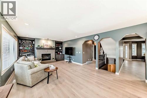 668 Scimitar Bay Nw, Calgary, AB - Indoor Photo Showing Living Room With Fireplace