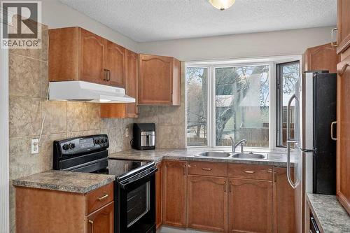3503 42 Street Ne, Calgary, AB - Indoor Photo Showing Kitchen With Double Sink