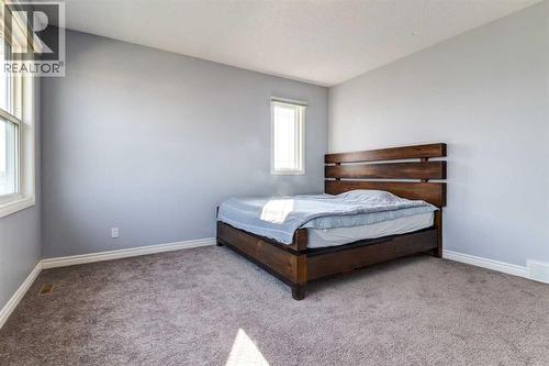 Master Bedroom - 14 Marquis Heights Se, Calgary, AB - Indoor Photo Showing Bedroom