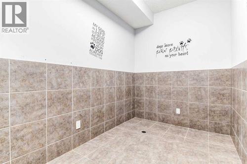 Dog wash station or storage room - 14 Marquis Heights Se, Calgary, AB - Indoor Photo Showing Bathroom