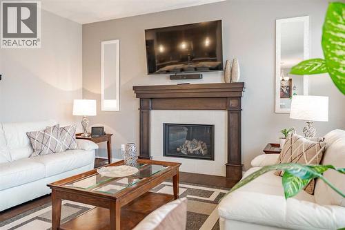 355 Evanston Way Nw, Calgary, AB - Indoor Photo Showing Living Room With Fireplace