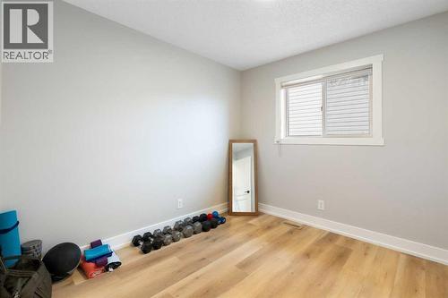 Bedroom # 1 - 111 Woodside Circle Nw, Airdrie, AB - Indoor Photo Showing Other Room