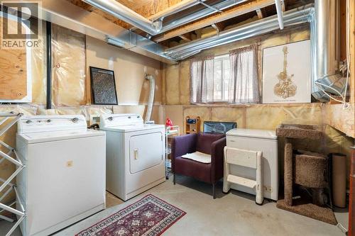 Laundry Room - 111 Woodside Circle Nw, Airdrie, AB - Indoor Photo Showing Laundry Room