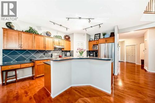 Tons of maple cabinets and large pantry - 11931 Valley Ridge Drive Nw, Calgary, AB - Indoor Photo Showing Kitchen