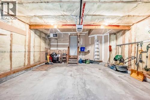 Double insulated, heated garage - 11931 Valley Ridge Drive Nw, Calgary, AB - Indoor Photo Showing Basement