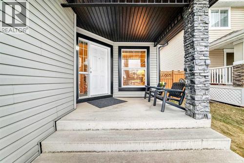 Front porch with lounging area - 11931 Valley Ridge Drive Nw, Calgary, AB - Outdoor With Deck Patio Veranda With Exterior