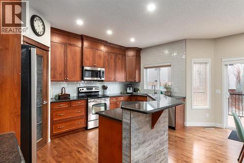 128 Seagreen Manor, Chestermere, AB - Indoor Photo Showing Kitchen With Stainless Steel Kitchen
