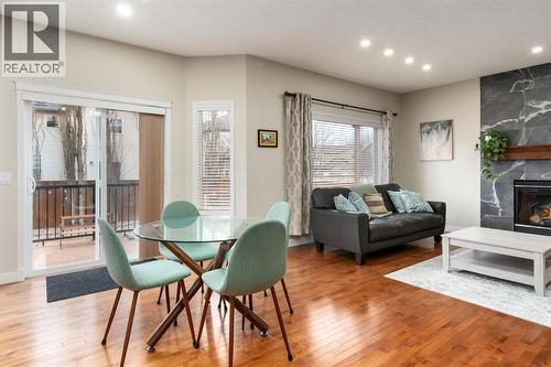 Bright South facing sunlight - 128 Seagreen Manor, Chestermere, AB - Indoor With Fireplace