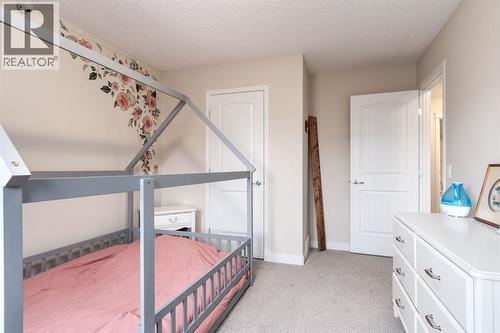 128 Seagreen Manor, Chestermere, AB - Indoor Photo Showing Bedroom