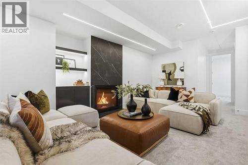 134 Lissington Drive Sw, Calgary, AB - Indoor Photo Showing Living Room With Fireplace