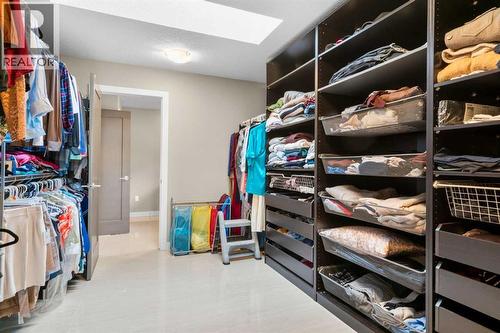 Primary Walk in closet - 173 Sage Meadows Circle Nw, Calgary, AB - Indoor With Storage