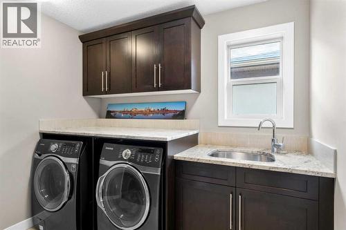 Upstairs laundry room - 173 Sage Meadows Circle Nw, Calgary, AB - Indoor Photo Showing Laundry Room