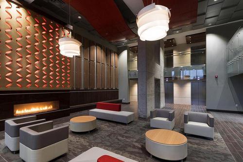 1106 300 Assiniboine Avenue, Winnipeg, MB - Indoor Photo Showing Other Room With Fireplace