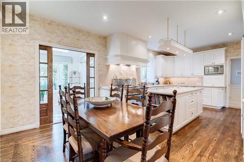 Dining area with wallpapered walls, healthy amount of natural light, french doors, dark wood-type flooring, and recessed lighting - 166 Maple Grove Drive, Oakville, ON - Indoor Photo Showing Dining Room