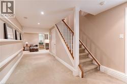 Staircase with carpet and recessed lighting - 