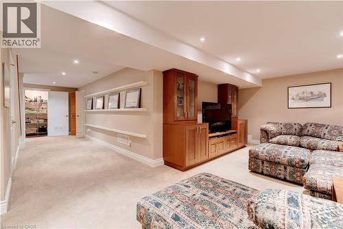 Living room featuring recessed lighting and light colored carpet - 166 Maple Grove Drive, Oakville, ON - Indoor
