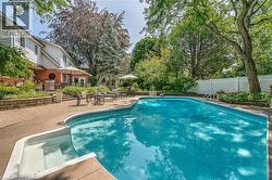 View of swimming pool featuring a patio area - 