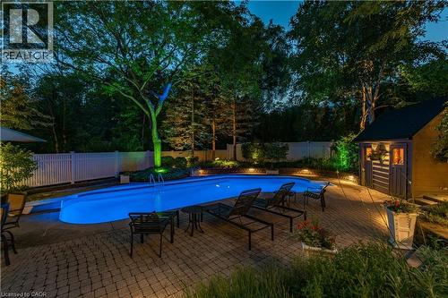 View of pool featuring an outbuilding, a patio, a fenced backyard, and a diving board - 166 Maple Grove Drive, Oakville, ON - Outdoor With In Ground Pool With Deck Patio Veranda With Backyard