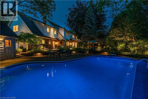 Pool at twilight - 166 Maple Grove Drive, Oakville, ON - Outdoor With In Ground Pool