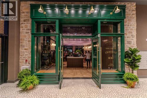 Entrance to property featuring stone siding - 24 Augusta Street Unit# 305, Hamilton, ON - 