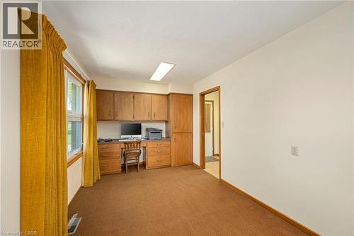 Unfurnished office with built in desk and light colored carpet - 6828 Third Line, Chatham, ON 
