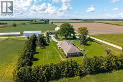 Overview of rural landscape featuring rows of crops - 