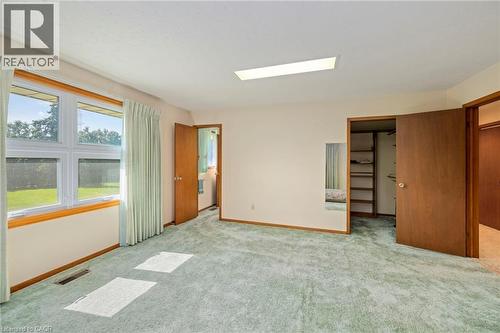 Unfurnished bedroom with carpet flooring and baseboards - 6828 Third Line, Chatham, ON - Indoor Photo Showing Other Room