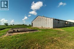 View of pole building with a lawn, a view of rural / pastoral area, and agricultural plots - 