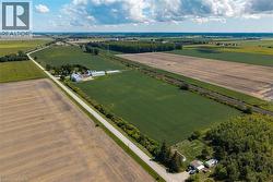 Aerial view of sparsely populated area featuring extensive farmland - 