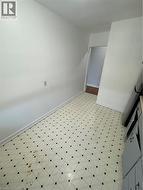 Unfurnished room featuring baseboards and light flooring - 