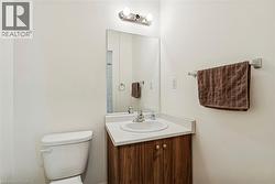 Bathroom featuring vanity and toilet - 
