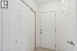 Doorway to outside featuring tile patterned flooring - 