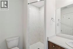 Bathroom with vanity and a stall shower - 